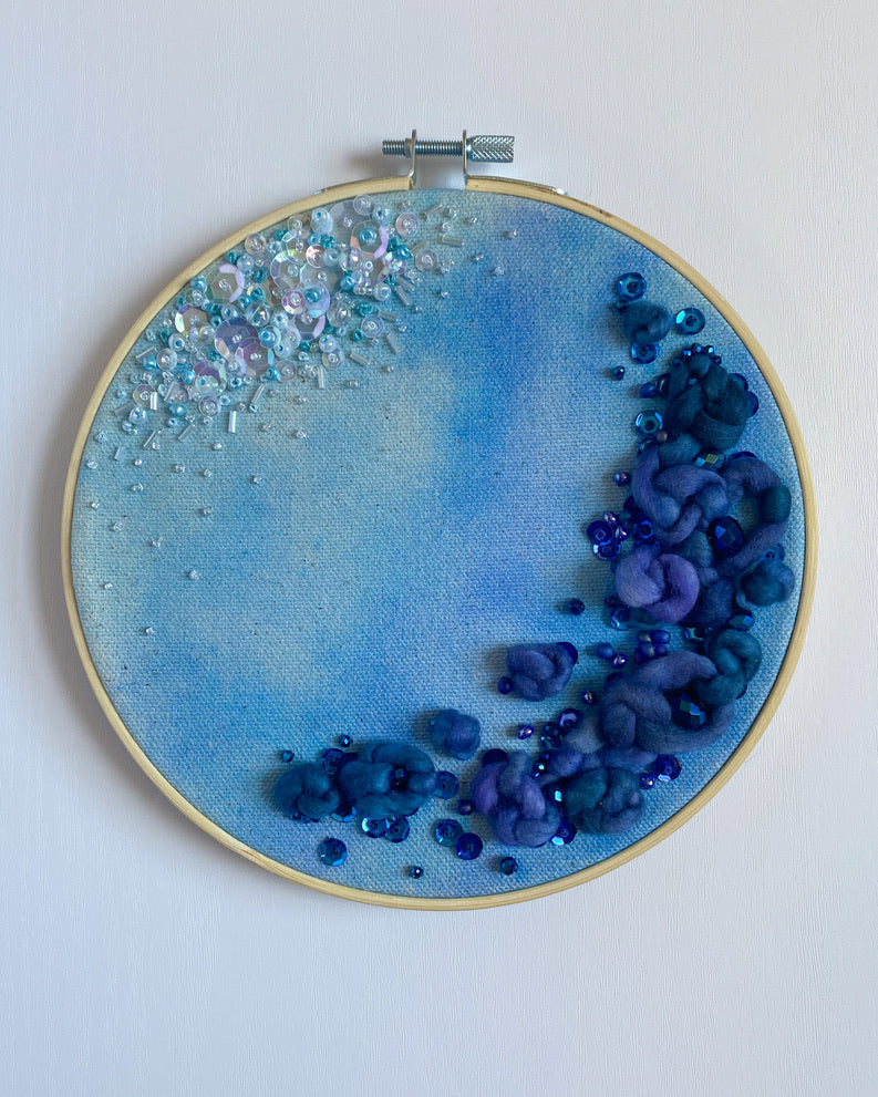 Watch this beaded and sequined embroidery hoop come to life. Shallows and Depths is an embroidery hoop art piece stitched on hand-painted watercolor canvas.